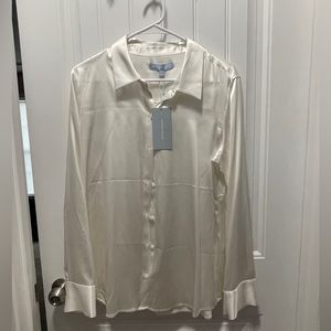 Beautiful silk top with tags still in tact and never worn.